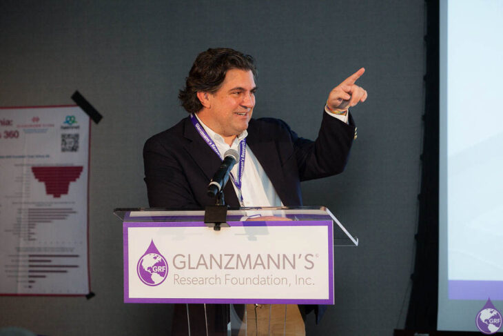 A man giving a presentation at the Glanzmann's Thrombasthenia Research Foundation.